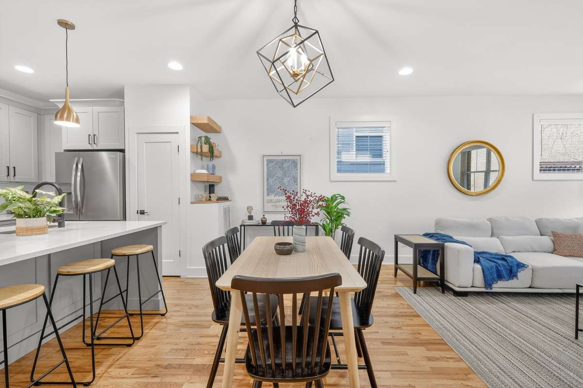 Dining area with so much seating. Easy access to the kitchen island for family style dining or entertaining.