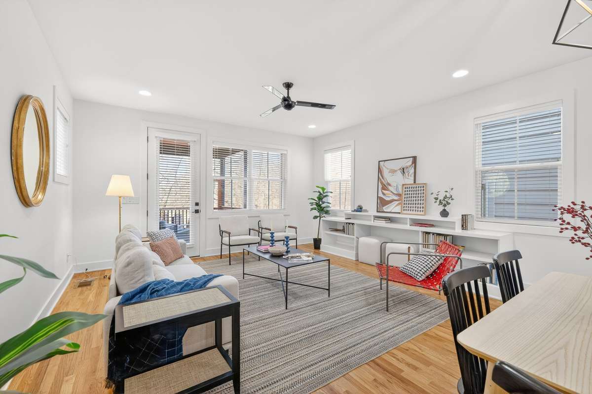 Built in shelving in the living room. Ceiling Fan Access to your covered and screened in deck. Custom Blinds installed throughout from the Home Depot.
