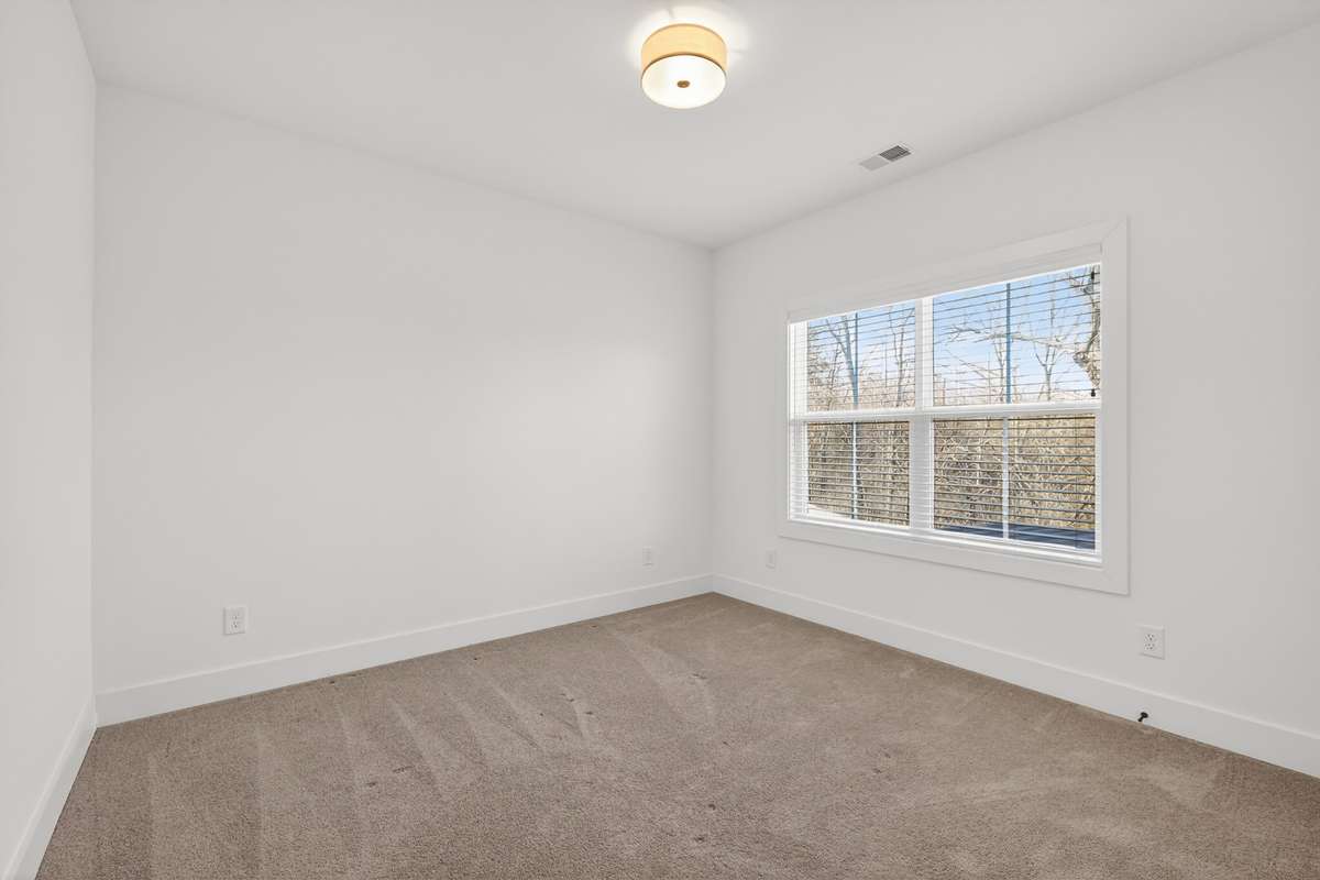 Third bedroom with large walk-in closet. This bedroom also shares access to the Jack-and-Jill balthroom.