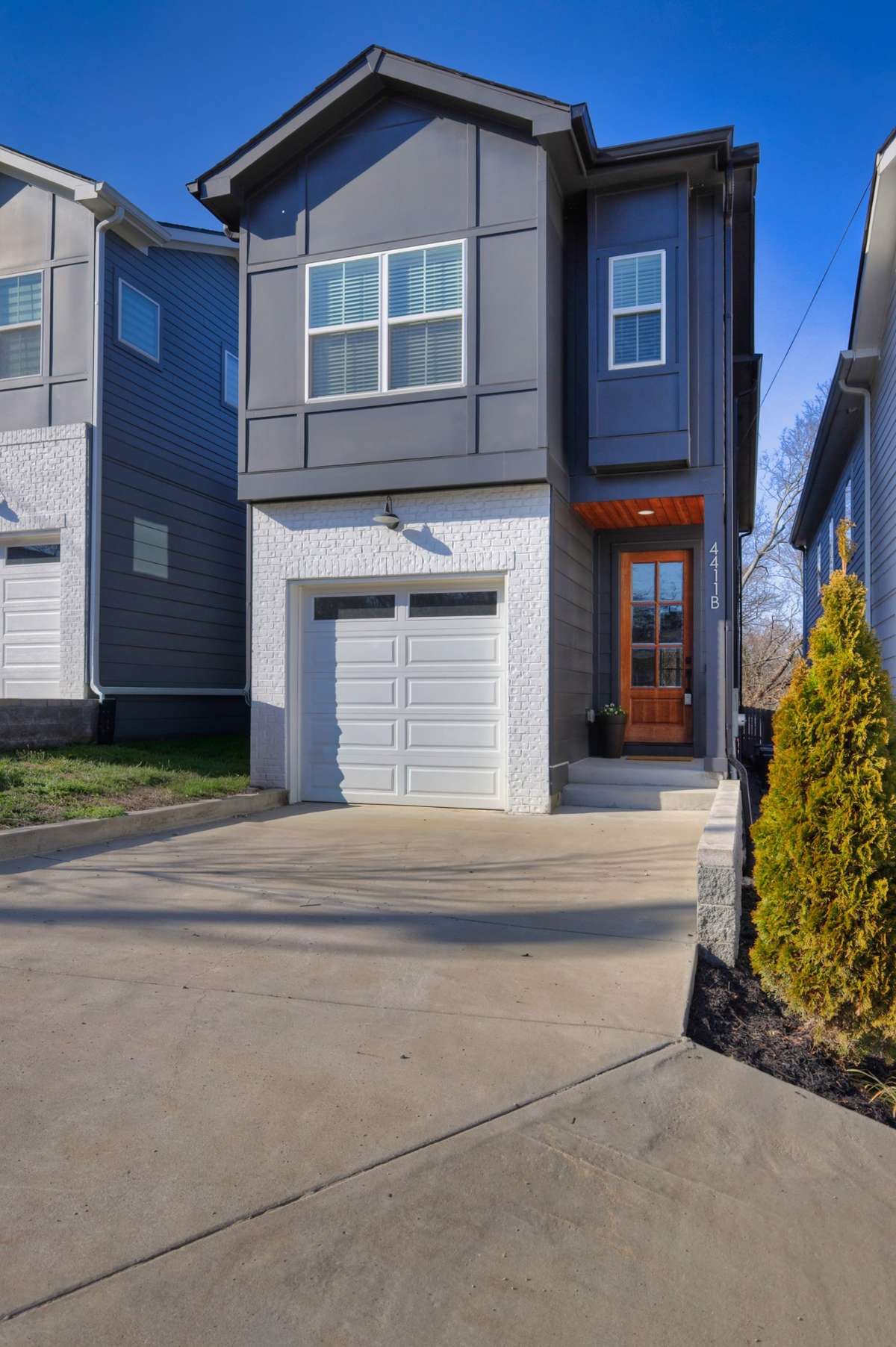 Front of the home showing the garage and front door.