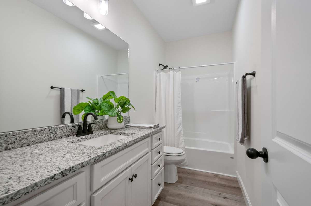 Guest bathroom downstairs .. AWESOME CABINET SPACE & GRANITE COUNTERTOPS