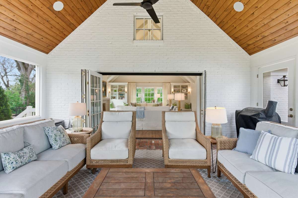 Beautiful porch off of den that opens to the large, level backyard.