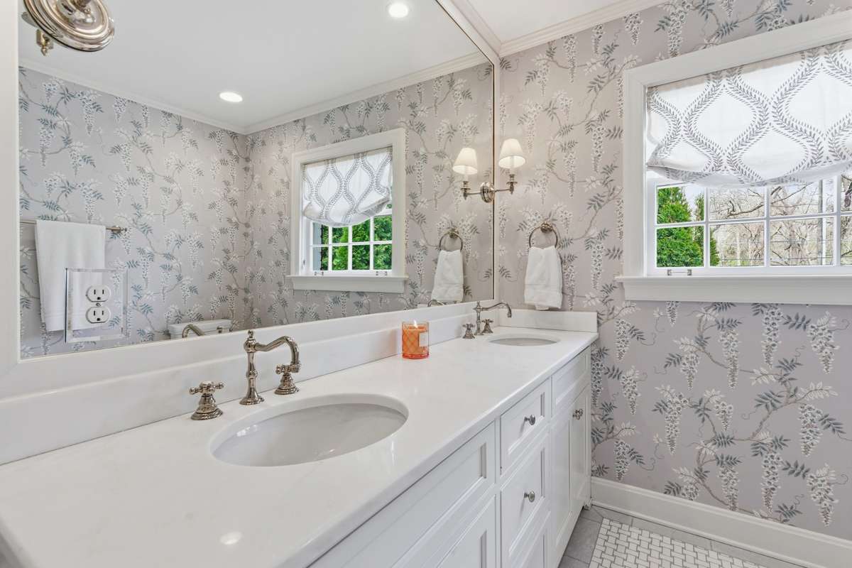 Double vanities with lots of storage below.