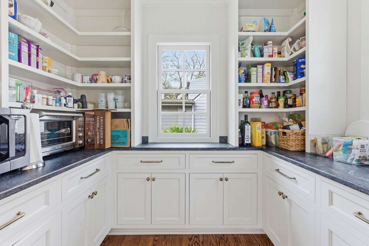 Walk-in pantry in kitchen. You will LOVE all the storage + space for extra appliances.