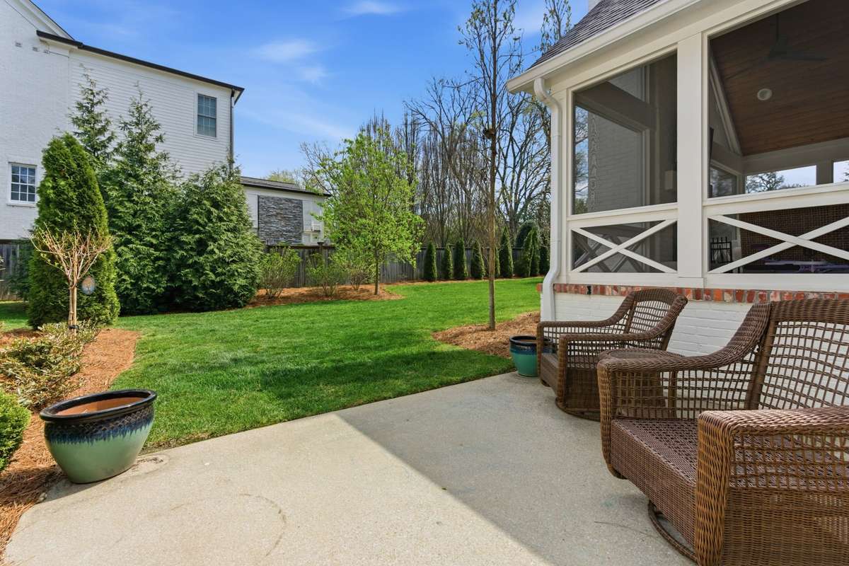 Back patio off of screened porch - open to backyard.