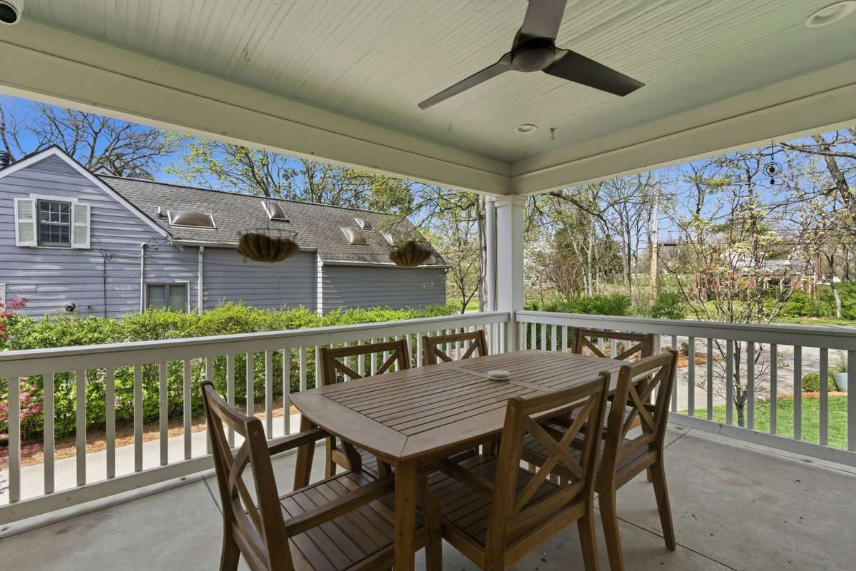 Side porch off of kitchen makes dining al fresco a breeze! Open up the door and have a cup of coffee or an easy meal outside!