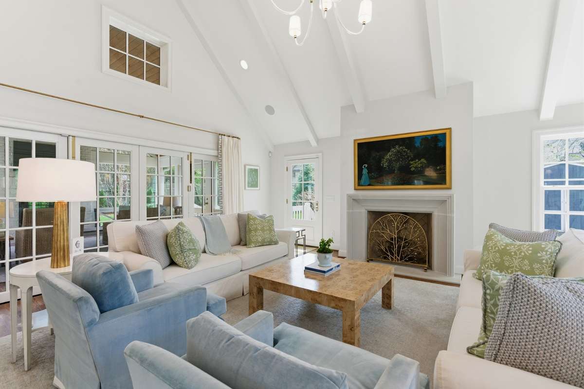 Opens to screened porch to allow for easy entertaining and indoor/outdoor living. Fireplace #2 in the home.
