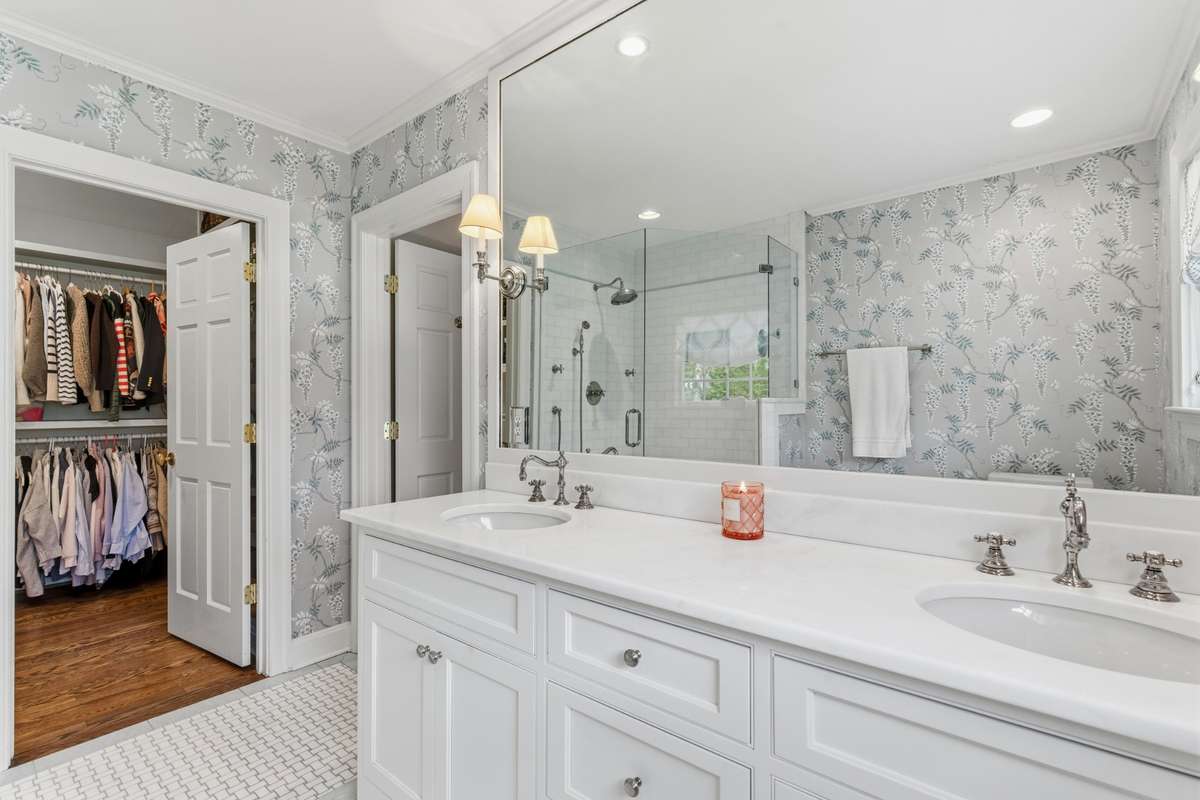 Walk-in closet in primary bedroom/bath.