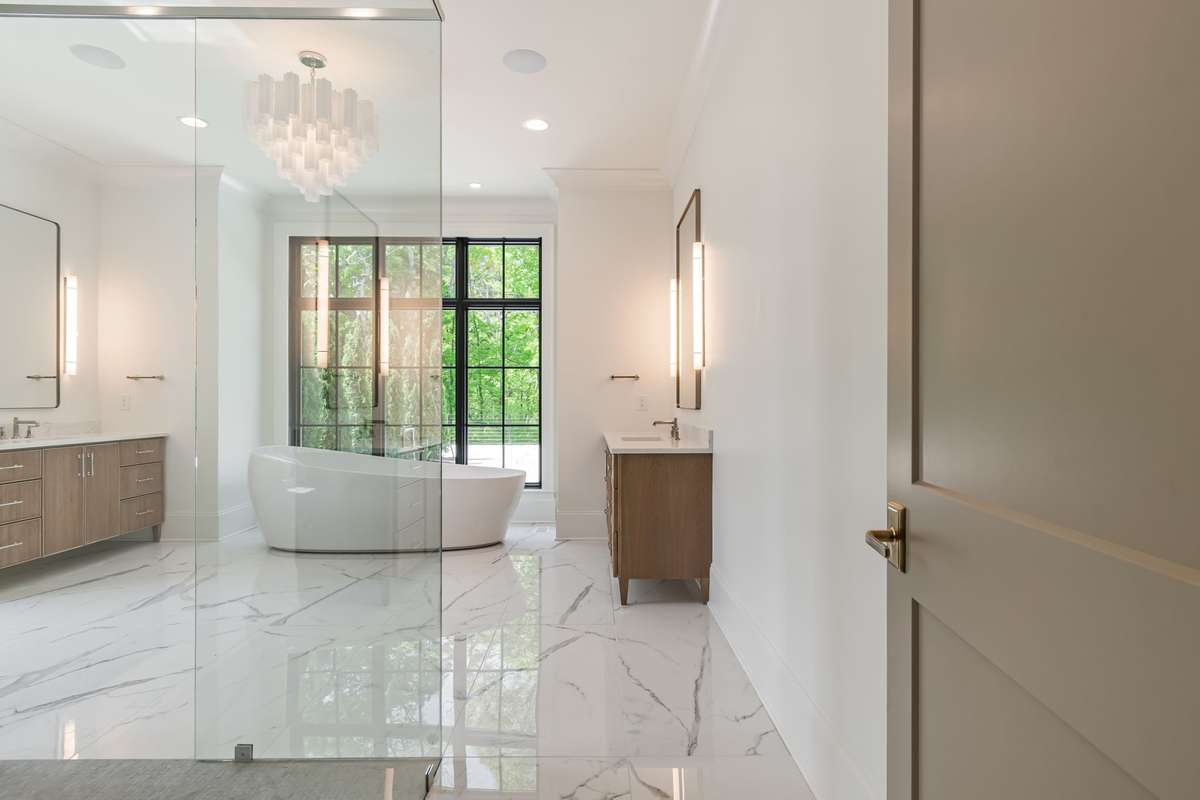Primary Spa with two vanities, large curbless shower and luxurious free standing tub!