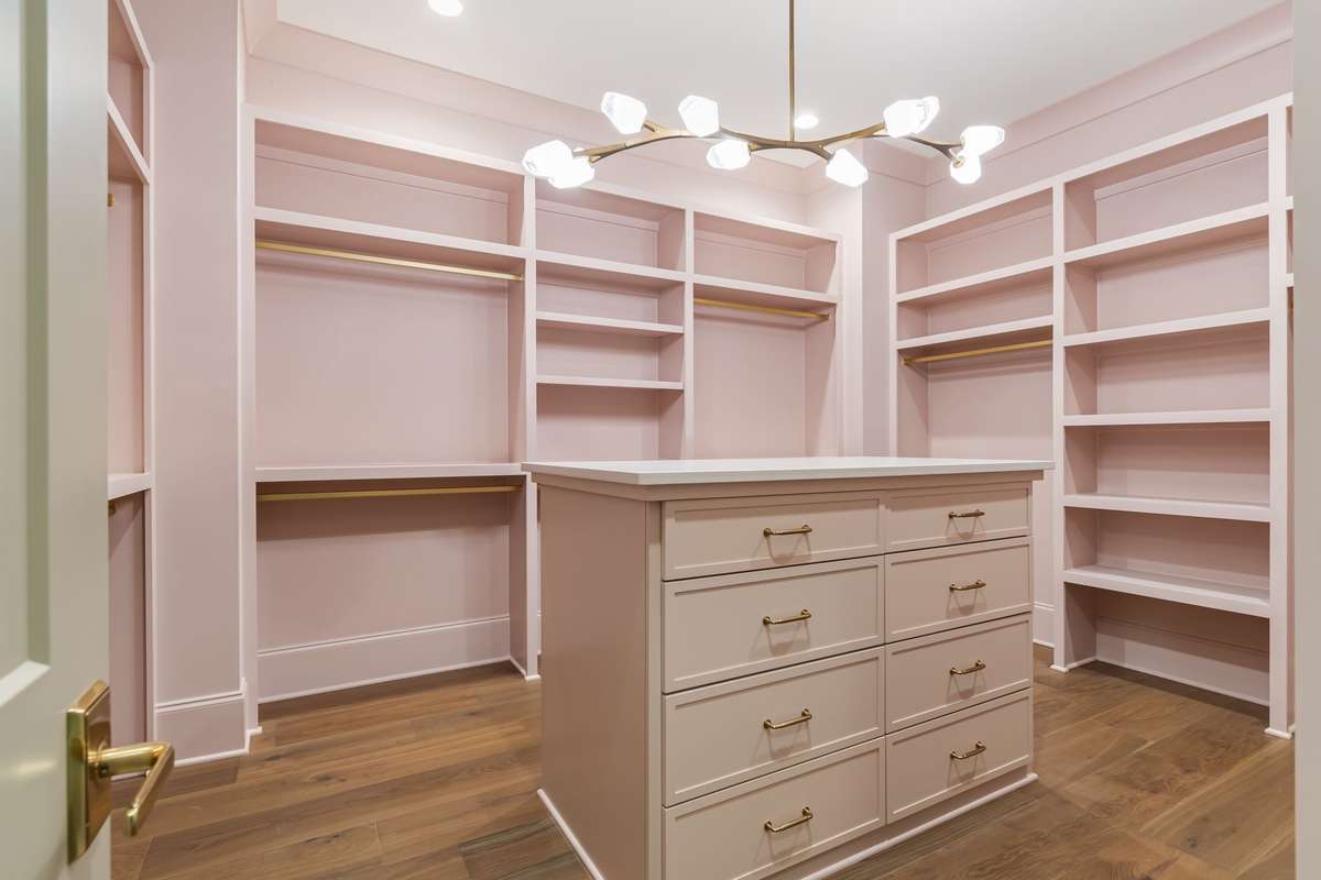 Separate closets in the primary bedroom. This is one of two.