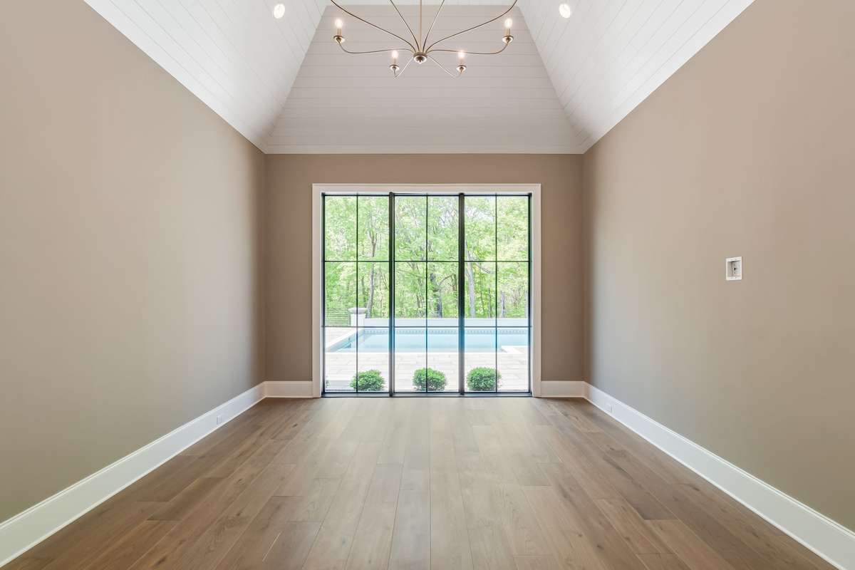 Primary Bedroom on main level offers gorgeous sunset views off the back.