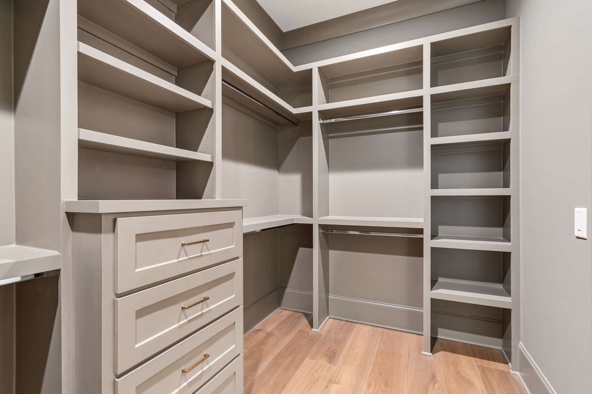 Separate closets in the primary bedroom. This is one of two.