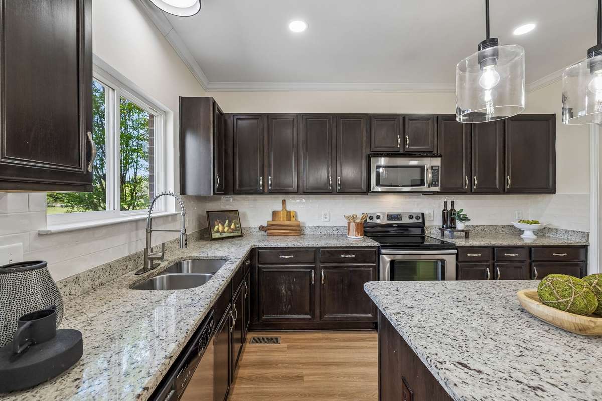 New floors, lighting, backsplash, and faucet!