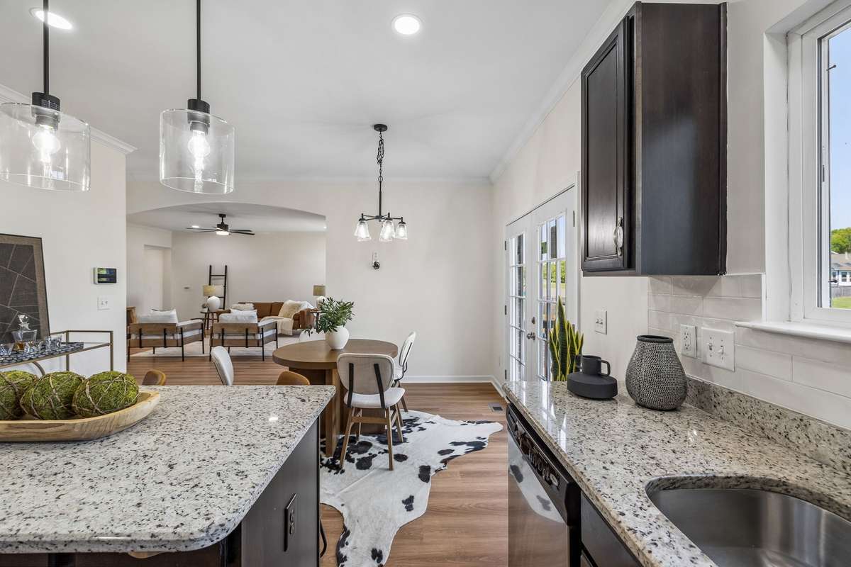 New floors, lighting, backsplash, and faucet!