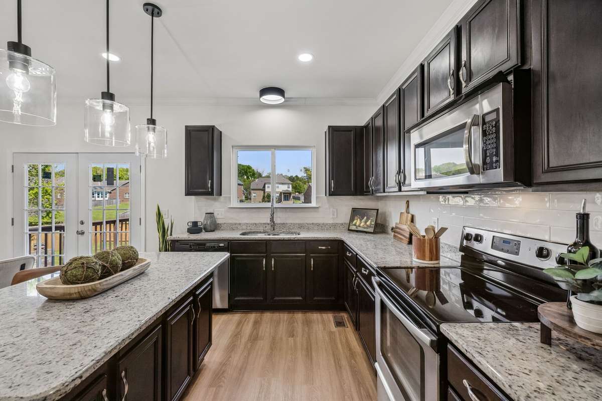 New floors, lighting, backsplash, and faucet!