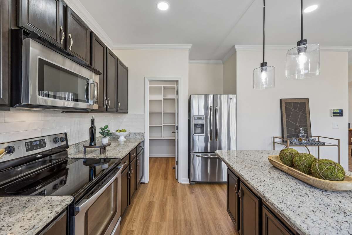 New floors, lighting, backsplash, and faucet!