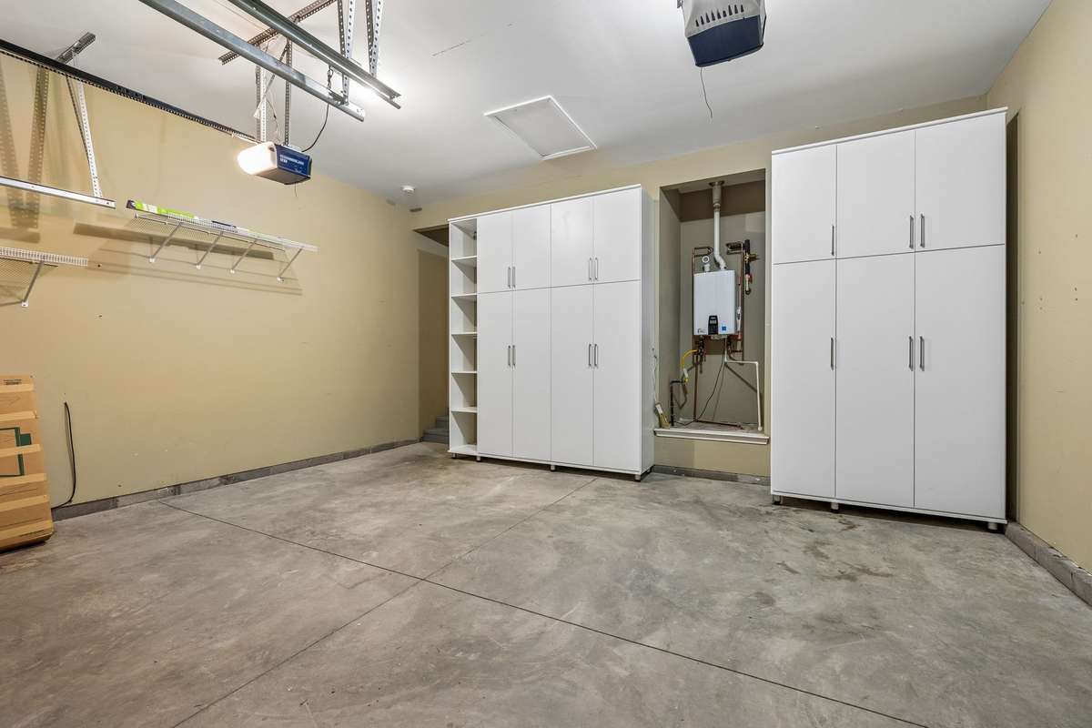 TONS of storage in these 8 foot custom cabinets! And a tankless water heater!