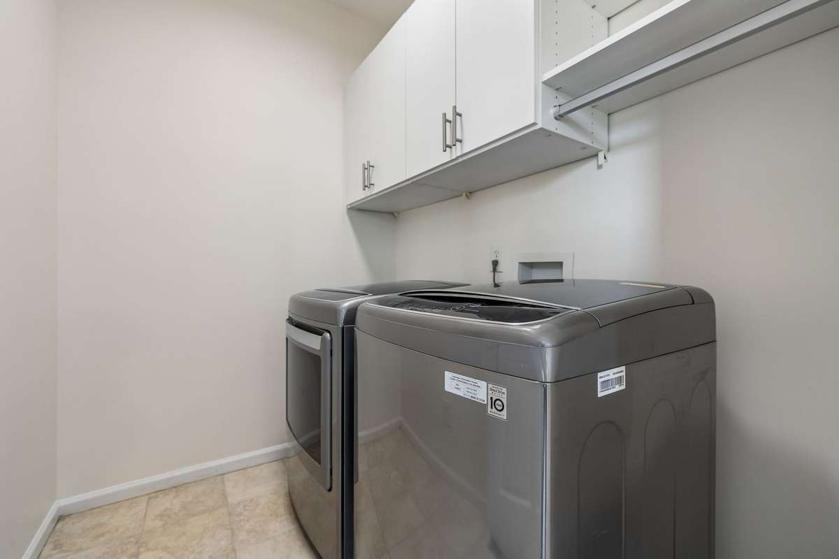 Washer and dryer in first floor laundry room convey with the property!