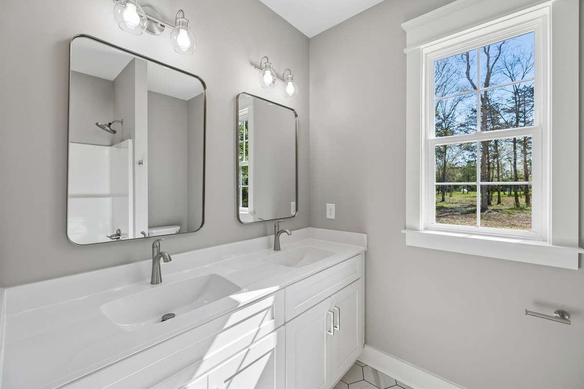 Second full bathroom on main floor between second bedroom and office space.