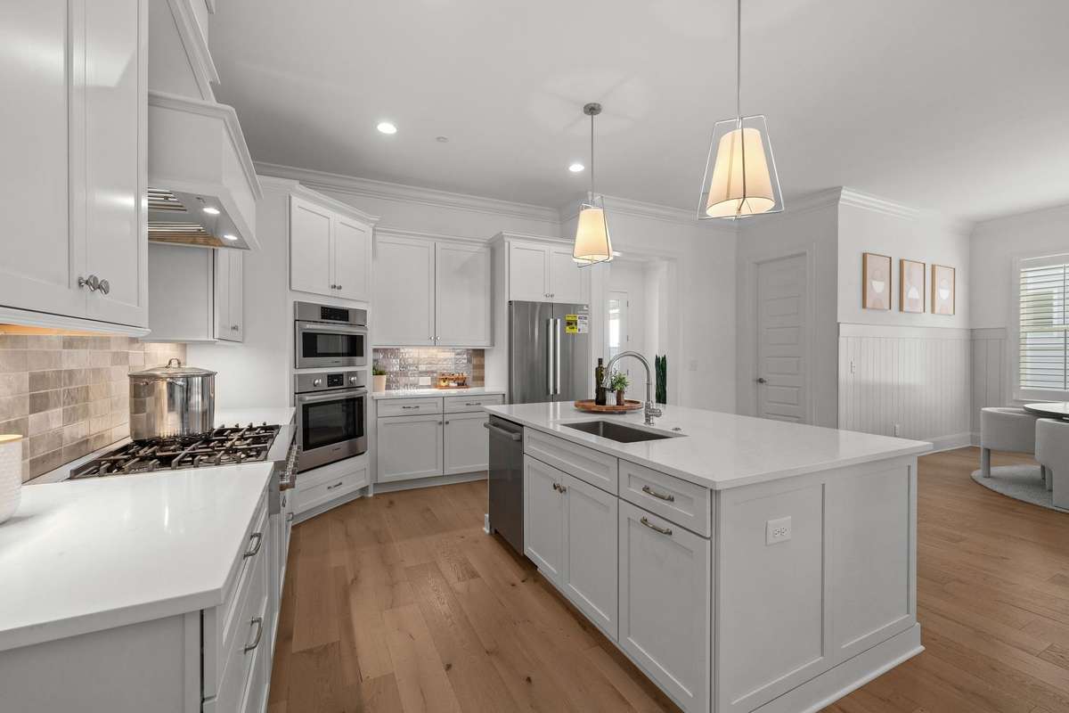 Photos represent a model home of the same floor plan and are not the actual home being constructed. Interior finishes, selections, and colors will be different.
