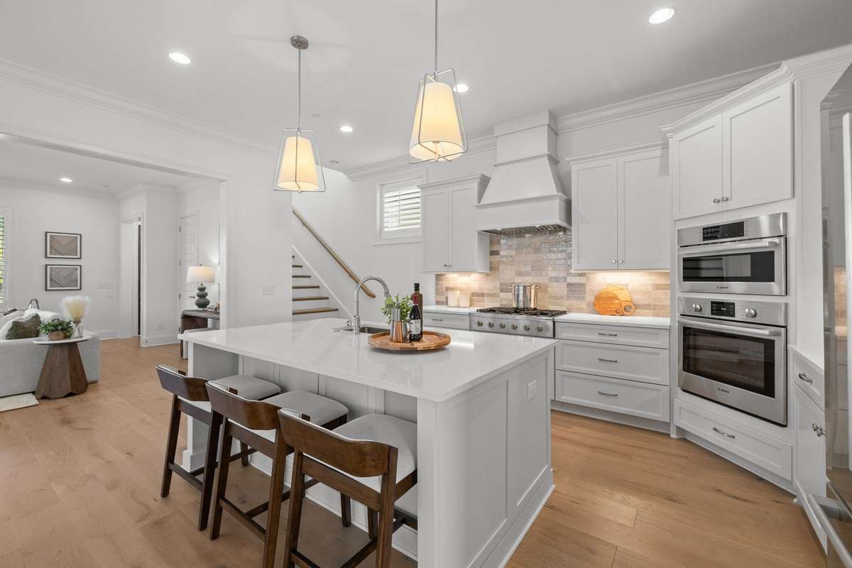 Photos represent a model home of the same floor plan and are not the actual home being constructed. Interior finishes, selections, and colors will be different.
