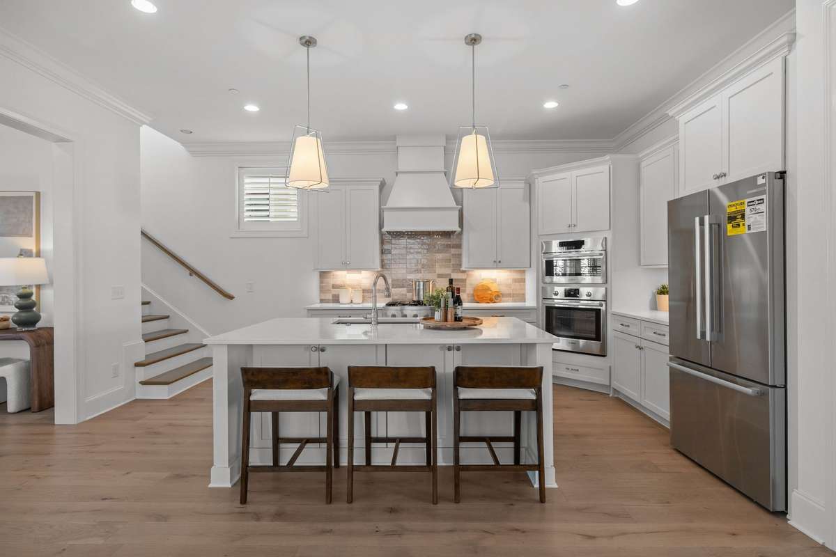 Photos represent a model home of the same floor plan and are not the actual home being constructed. Interior finishes, selections, and colors will be different.