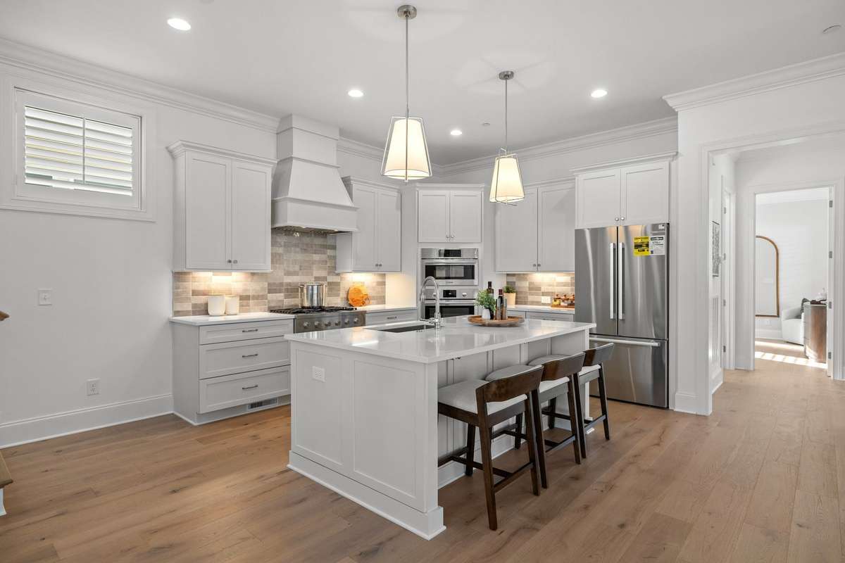 Photos represent a model home of the same floor plan and are not the actual home being constructed. Interior finishes, selections, and colors will be different.