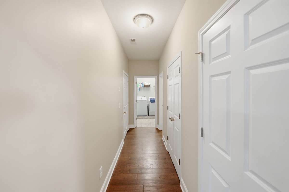 Hallway Leading to Extra Closets, Utility Room & Half Bath