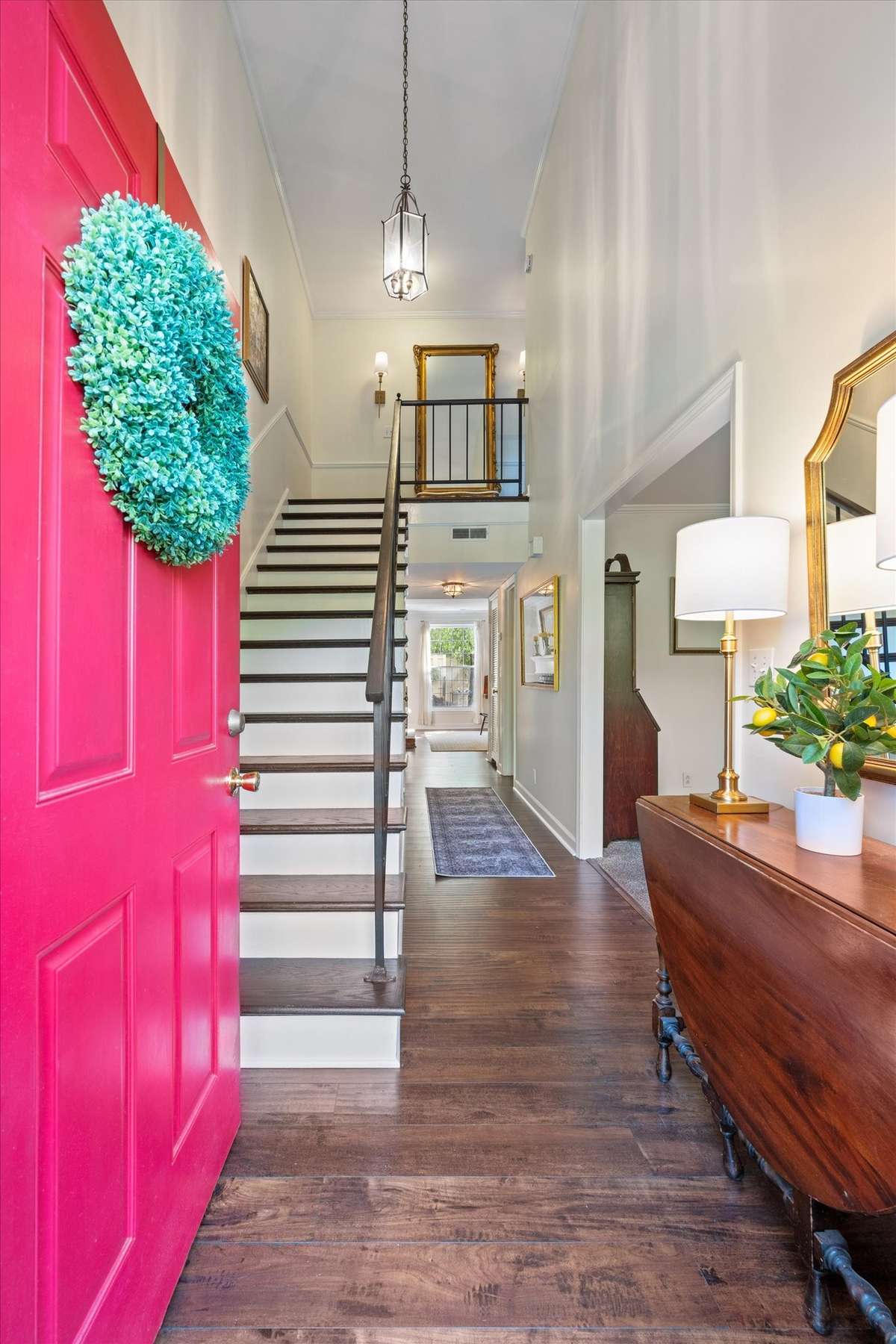 The two-story foyer welcomes you with new engineered hardwoods, creating a warm and inviting entrance