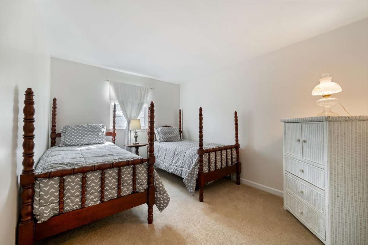 Bedroom 2. Window treatments and hardware do not convey with home