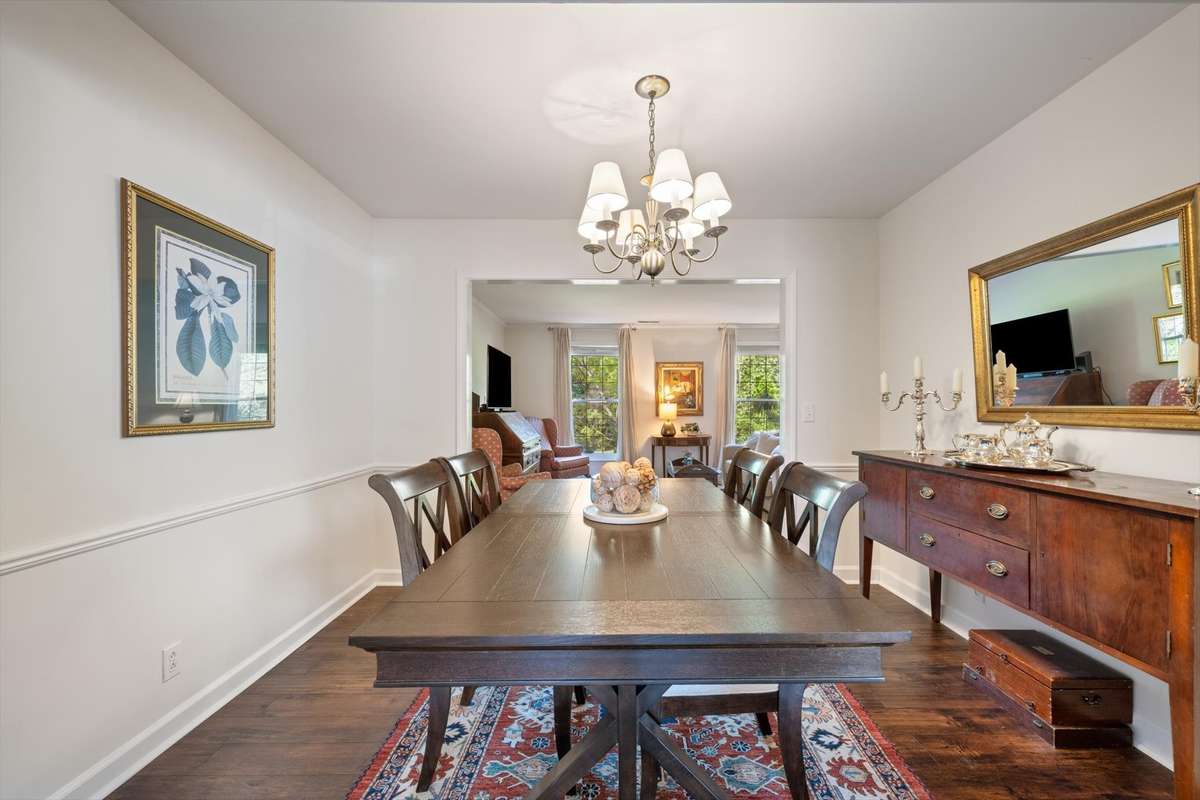 The formal dining room is right off the kitchen leading into the living room