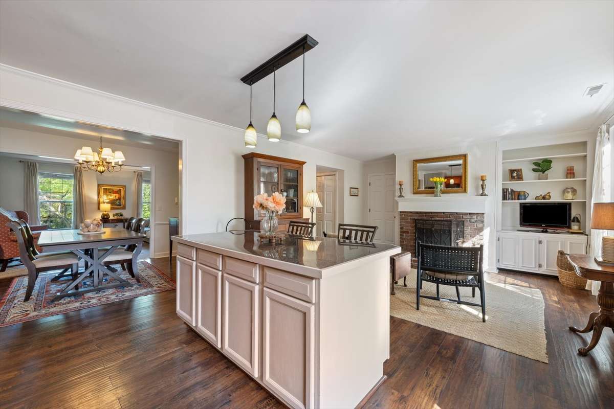 Opened up the space by removing a wall to create a larger kitchen, complete with a newly added island for enhanced functionality and gathering space.