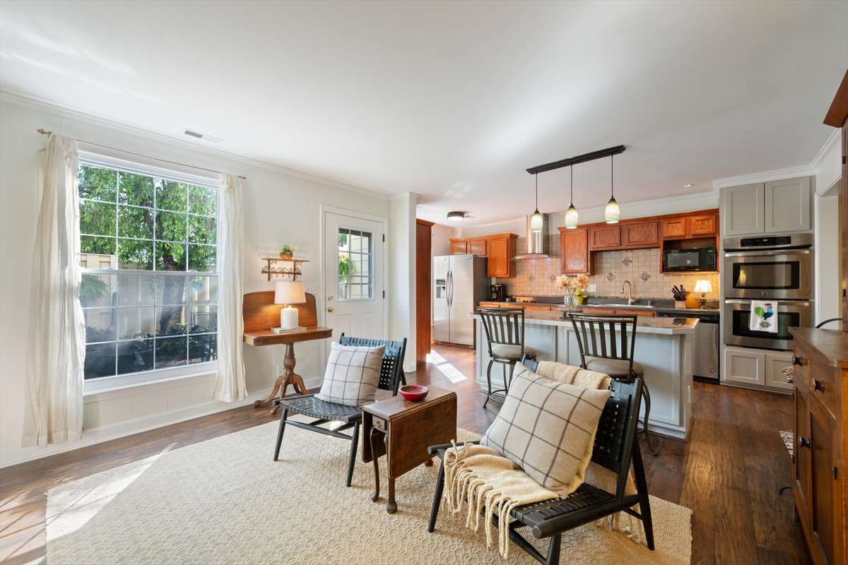 The perfect gathering space just off the kitchen, seamlessly leading out to your private patio for indoor-outdoor living.