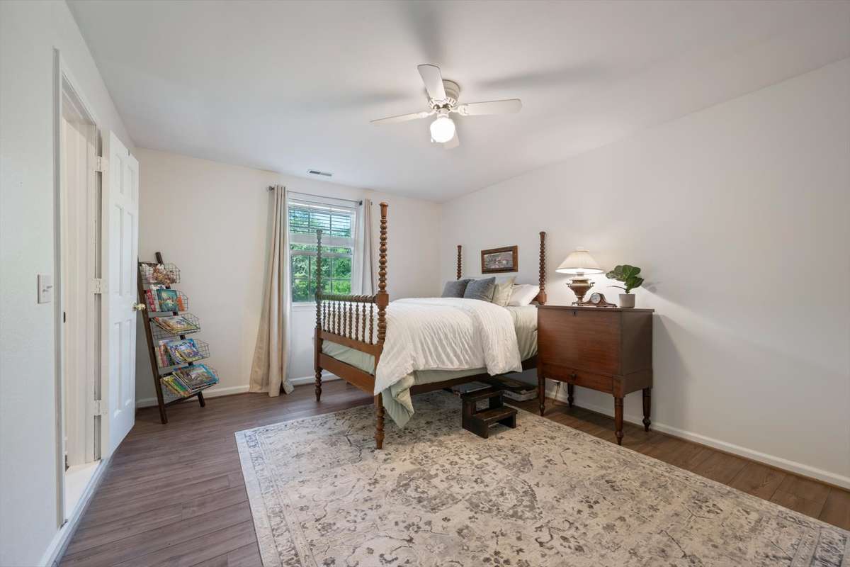 The downstairs flex room offers endless possibilities - perfect for a home office, workout space, guest bedroom, or playroom!