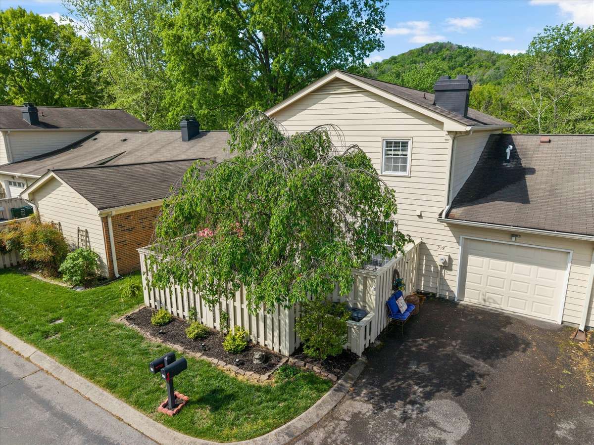 One car garage and parking pad driveway