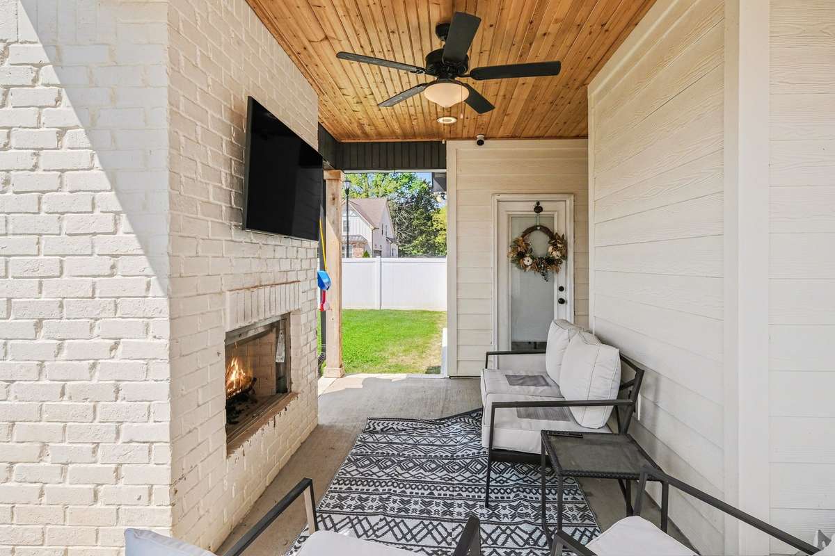 Wonderful outside covered back porch with fireplace!