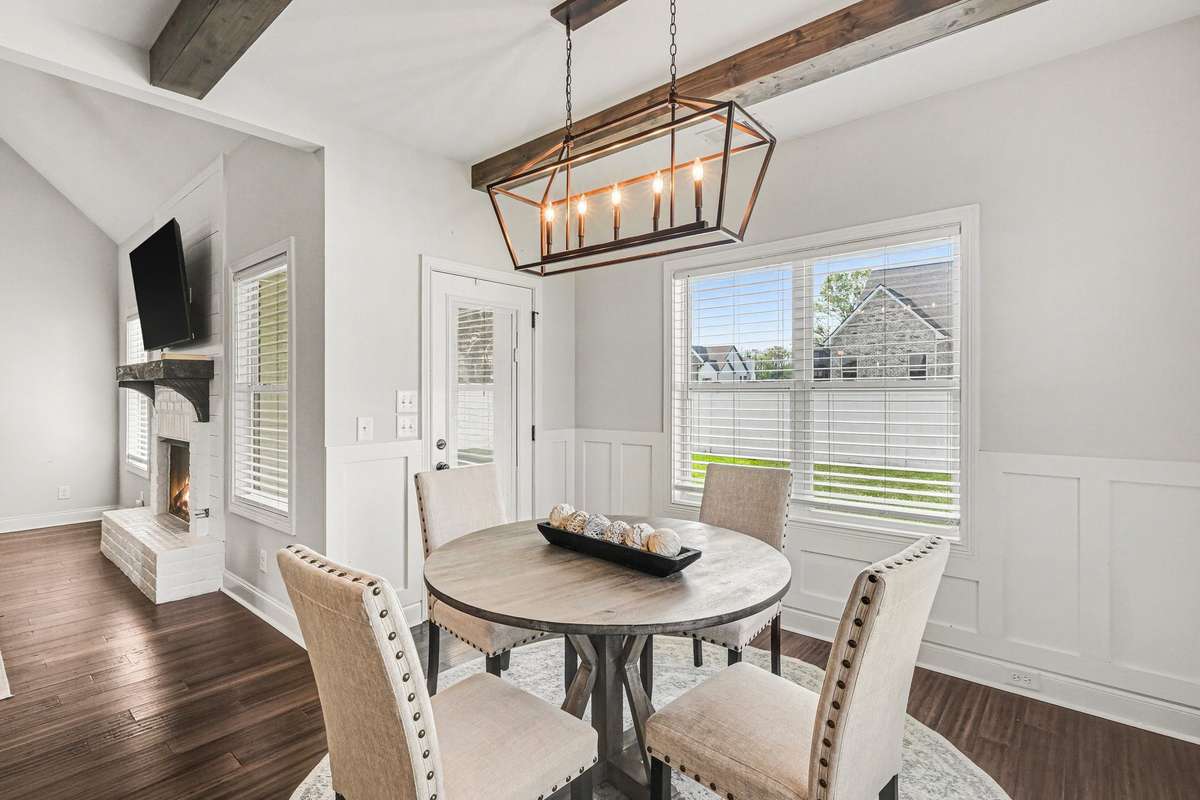 Love those beams and custom wall trim!