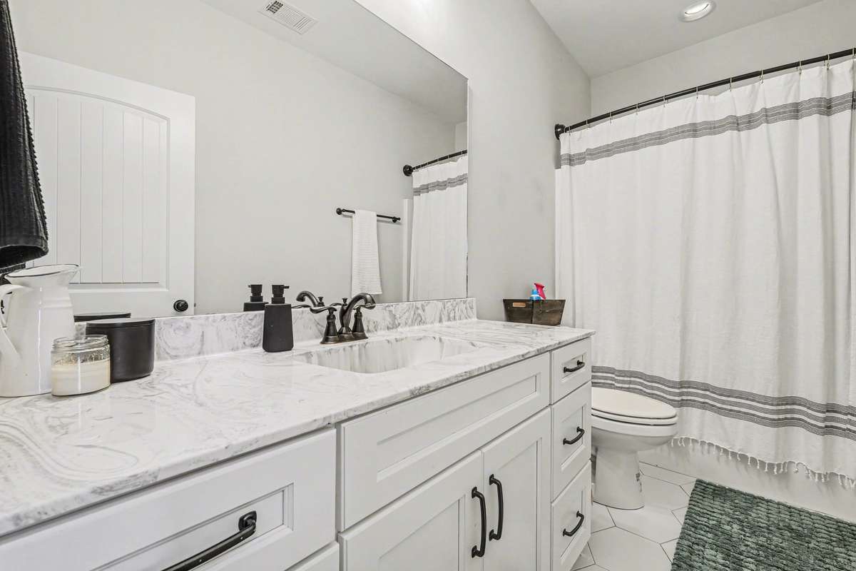 Upstairs full bath, love those hexagon tile floors!