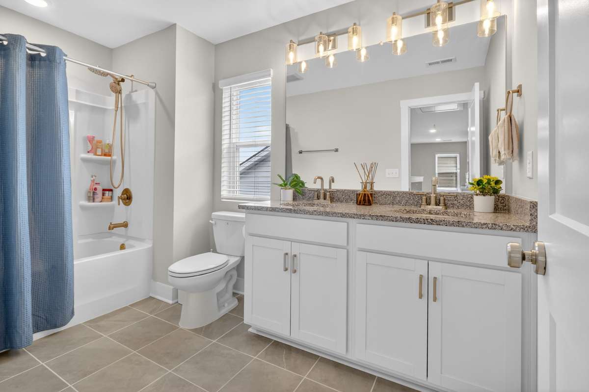 Spacious full bath with dual vanity and tub/shower combo