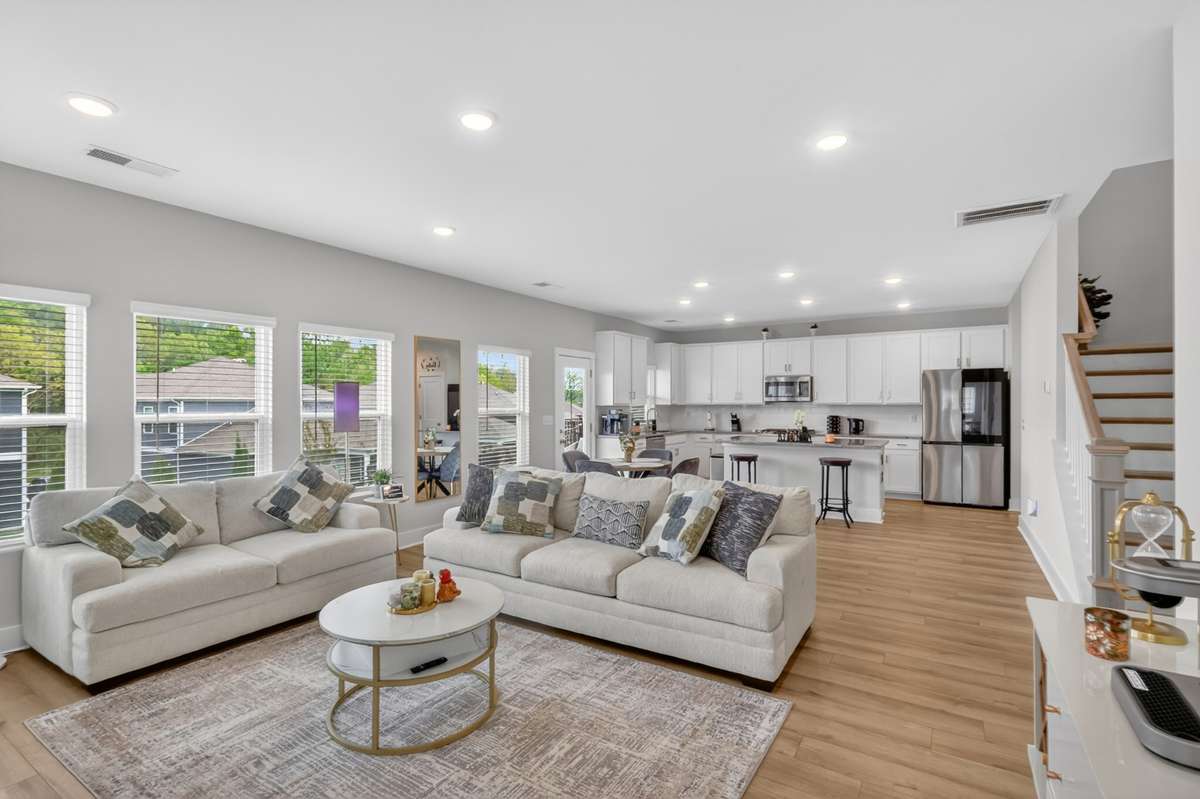 Light-filled living space with plentiful windows and warm natural sunlight.