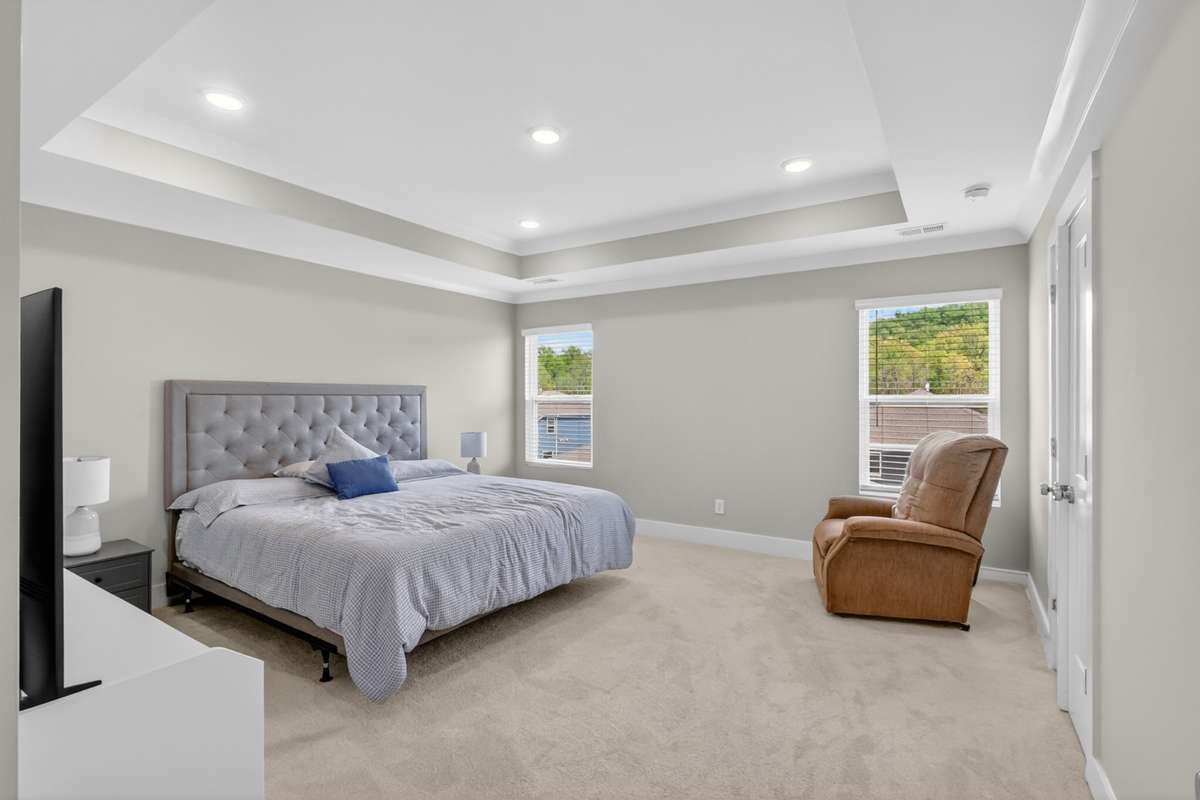 Well-appointed primary bedroom designed for comfort and space.