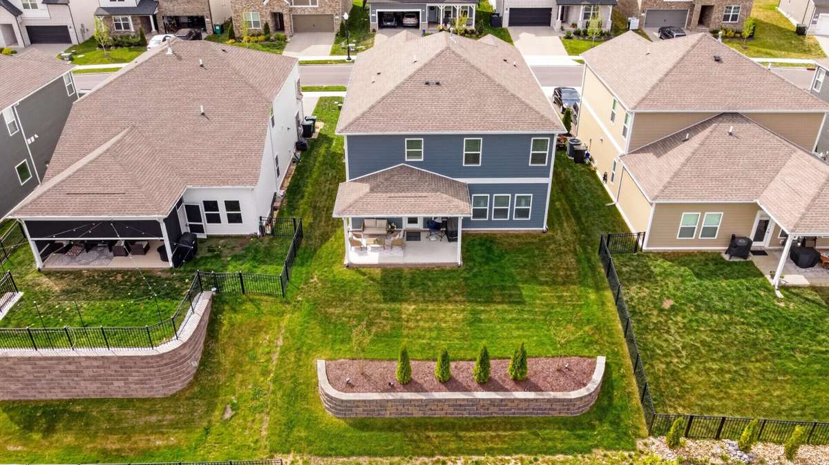 Retaining wall creates a leveled, usable backyard space.