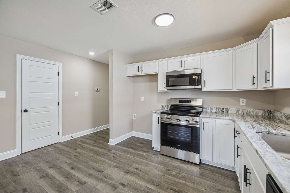 Sample pictures of a previous build showing the Meg Floor Plan.  Materials and Colors are subject to change without notice.