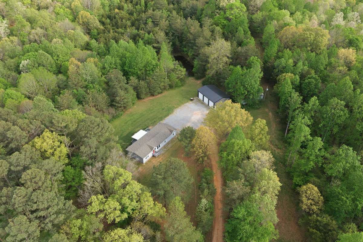 The most private hilltop retreat you will find with 5 acres already established!