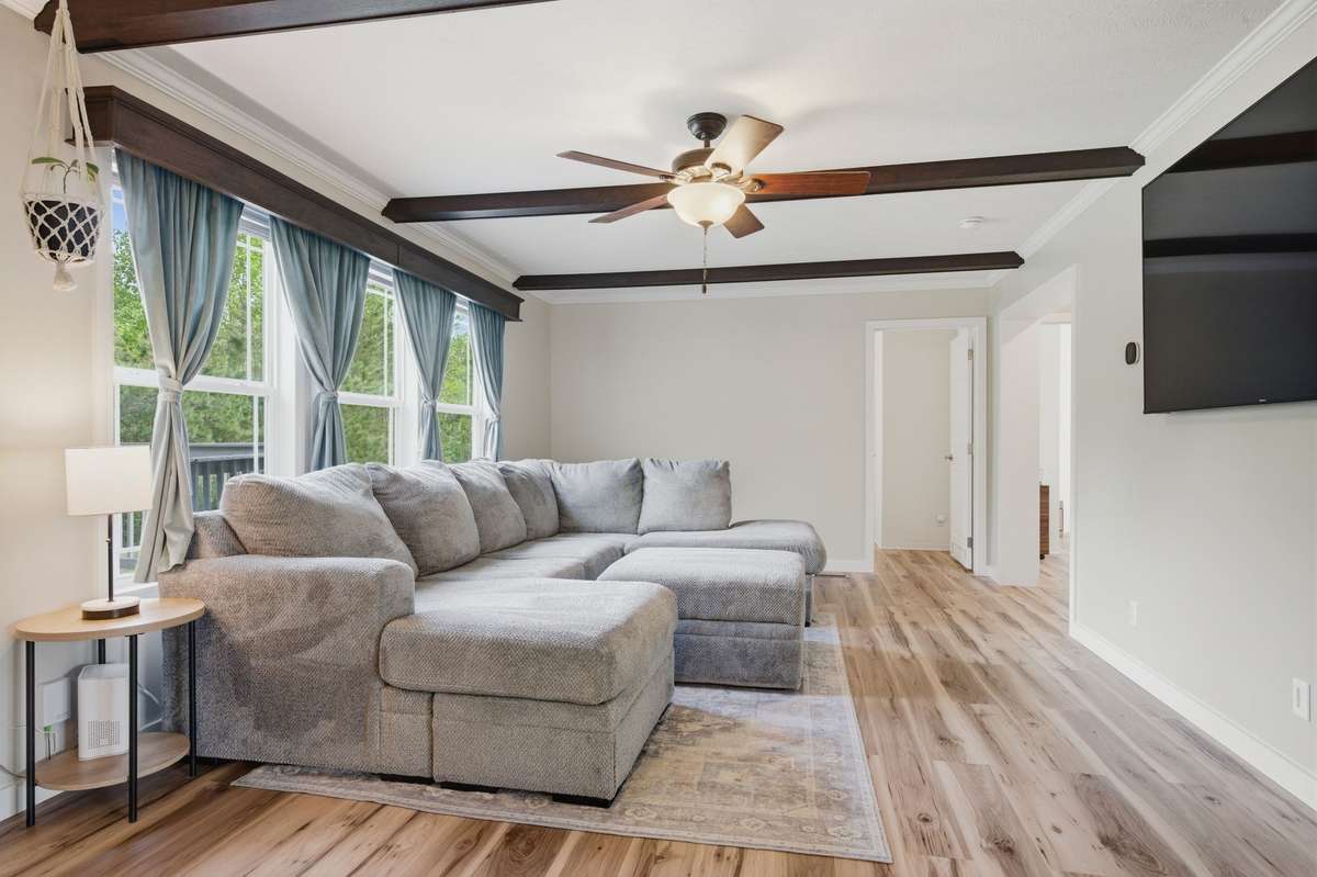 This is a second living area on the back of the home and directly off the kitchen which allows for conversations during meal prep!
