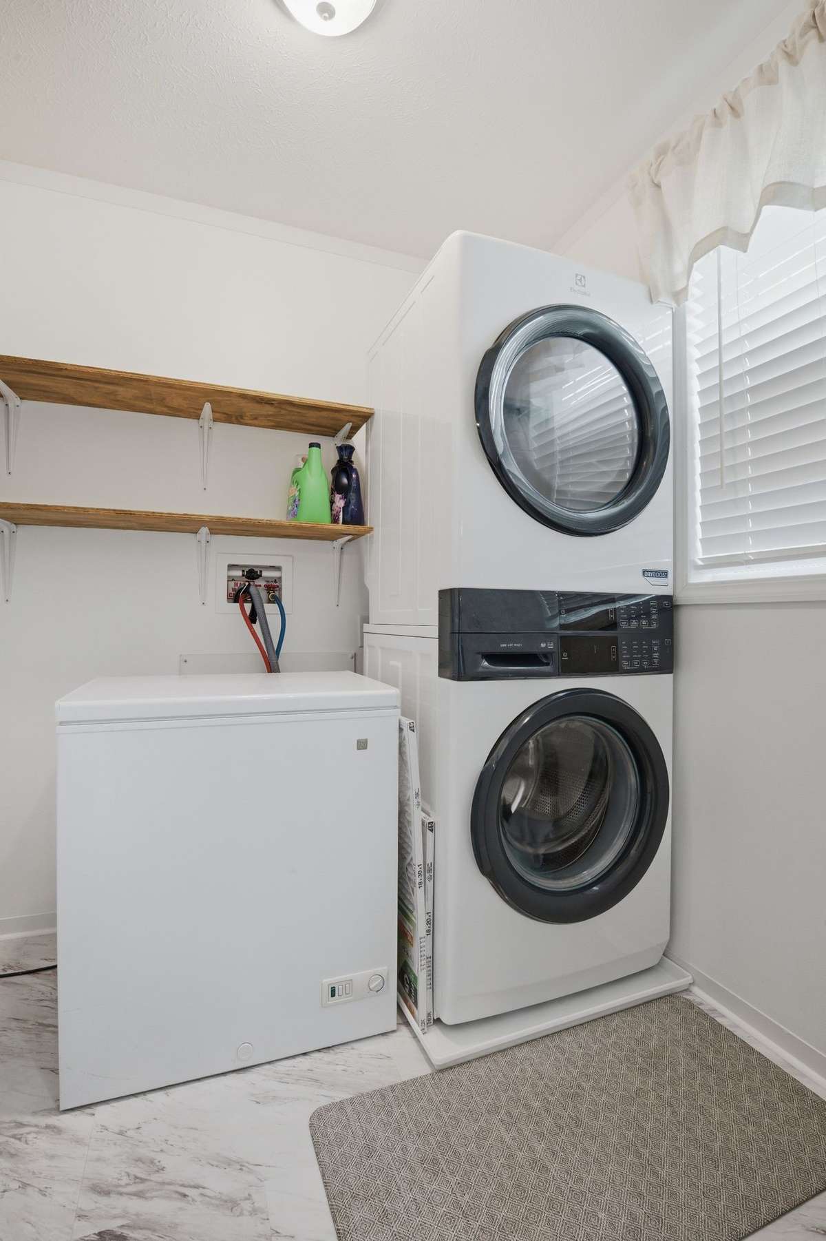 Stackable washer and dryer can convey with the home in a way to highlight added space in the HUGE utility room!