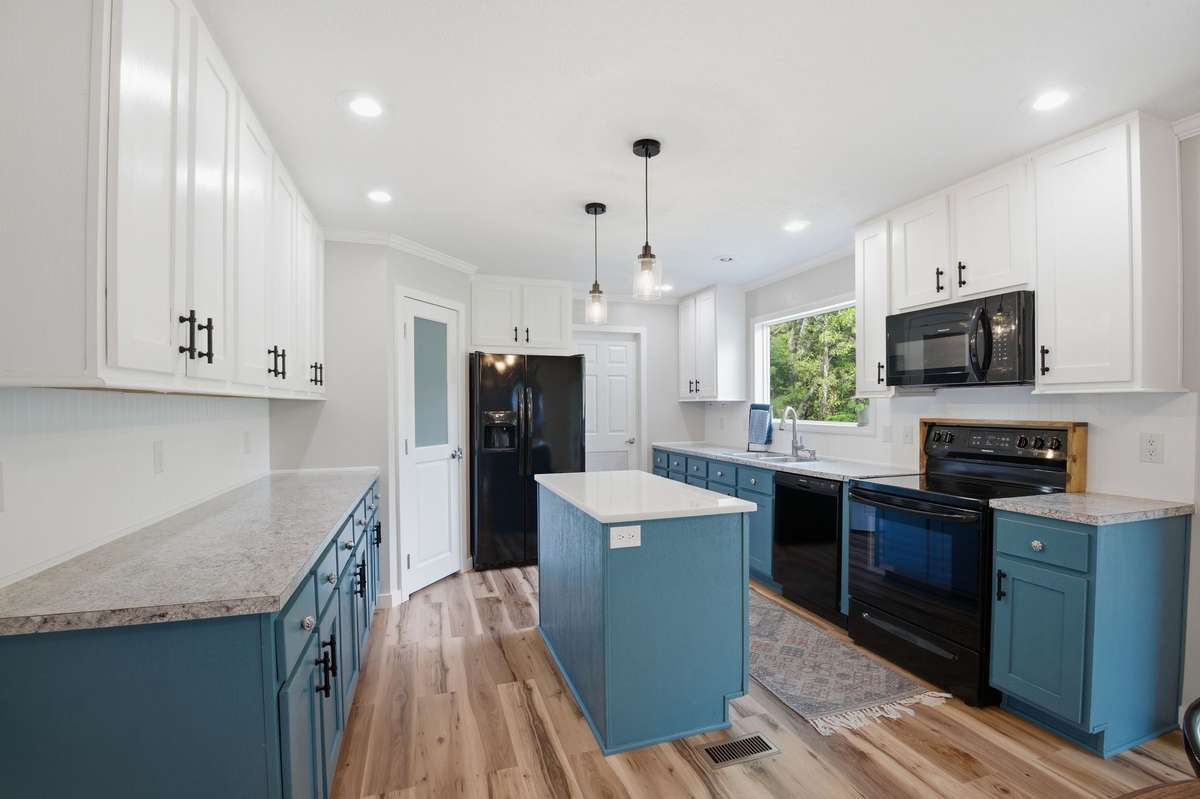 Beautiful kitchen island highlighted with a quartz countertop!