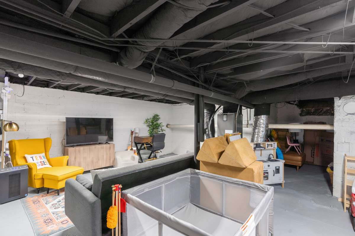 Basement area is currently being used as a rec room and play area.