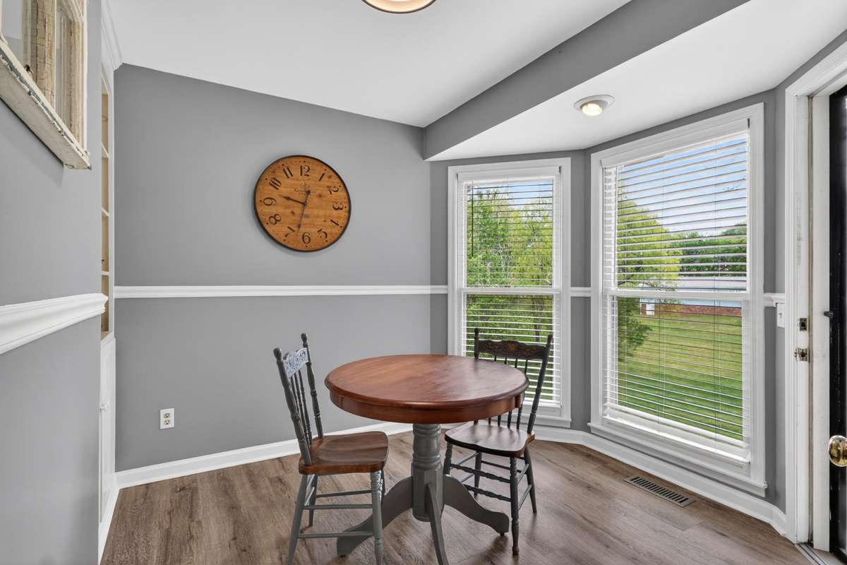 There is convenient shelving to the left of the breakfast nook.