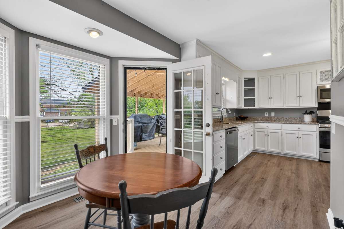 Lovely breakfast nook just next to the bay windows and the door to the new deck.